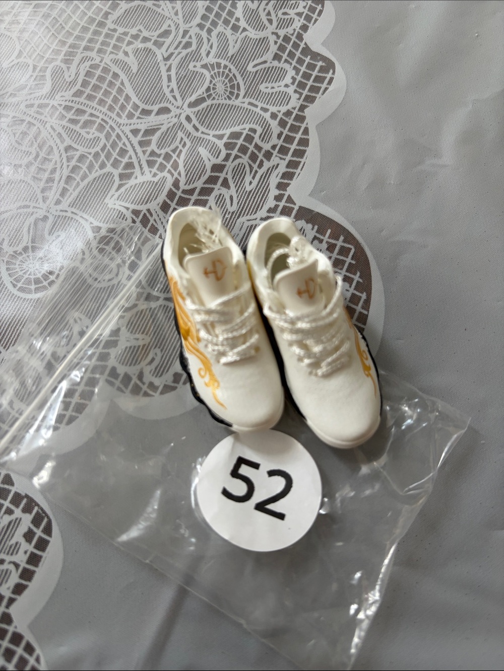 52, White and Gold Mini Sneakers - Nike SB Logo.
